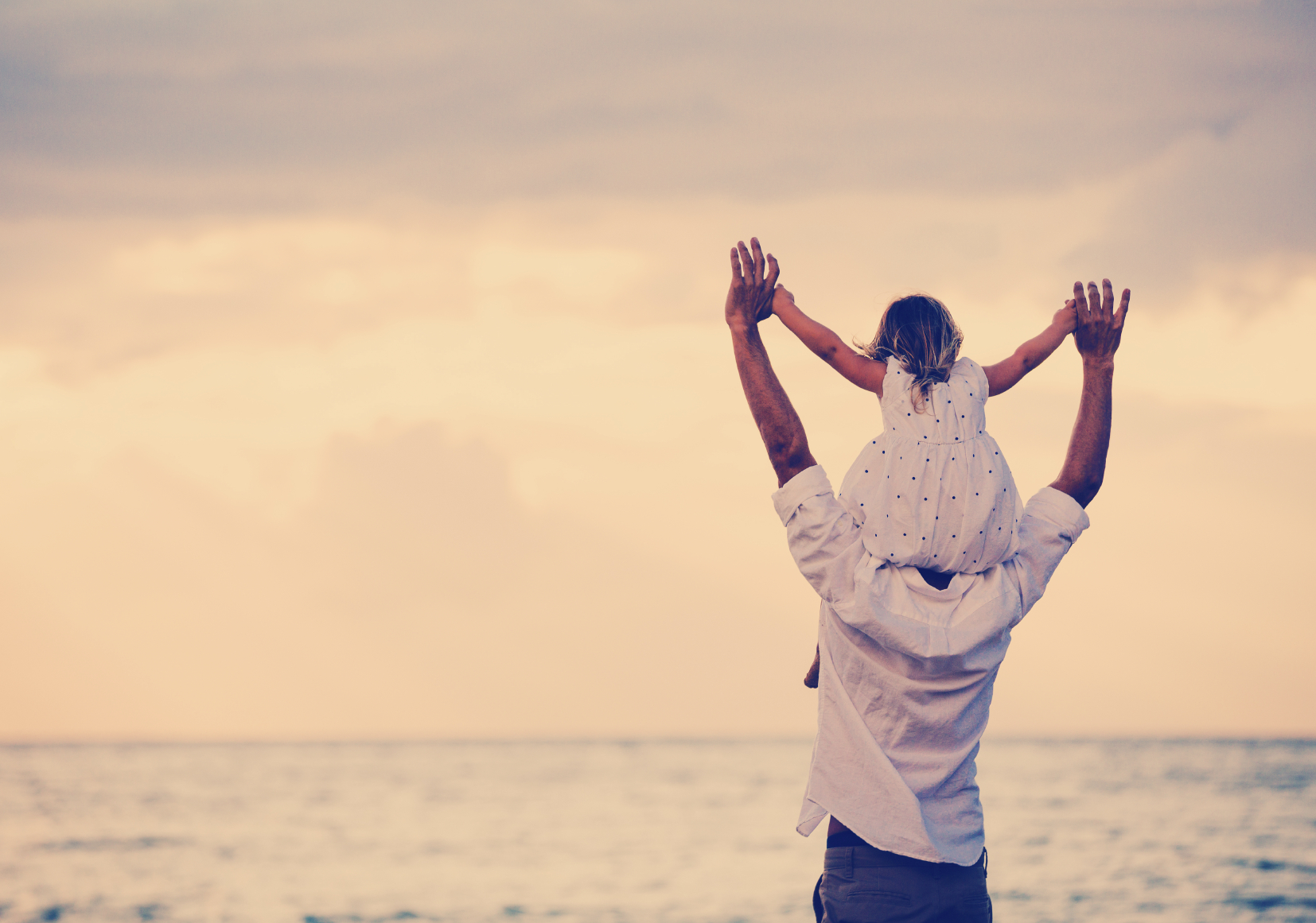 Father and Daughter Playing Together at the Beach at Sunset. Happy Fun Smiling Lifestyle